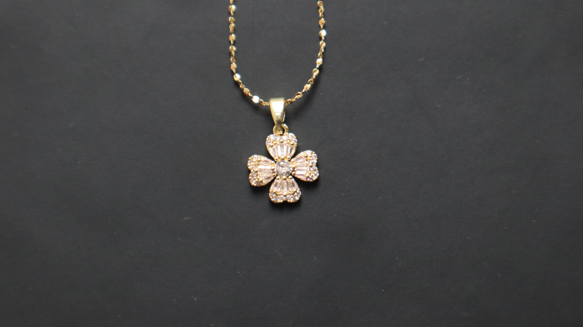 Crystal bow pendant necklace with gold-tone chain by SHUKR